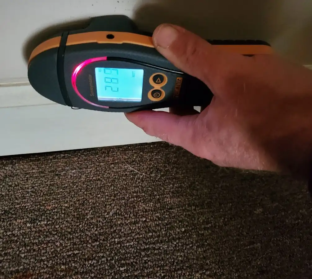 Moisture detection at baseboard during Burst Pipe Cleanup in New River